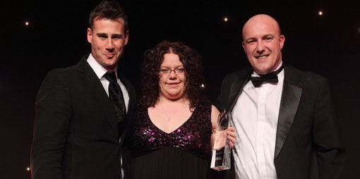 Tim Vincent, support person winner Donna Walker of Vertex Data Science and John Trace
