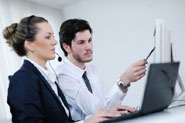 agent sat at work station being trained