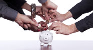 staff putting money into piggy bank