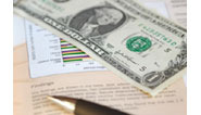 pen, graph and dollar bill