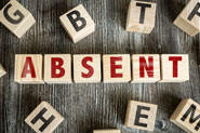 Letter blocks spelling out the word absent