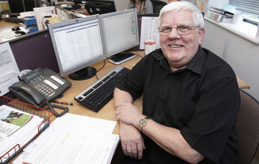 malcolm Jeffrey sat at his desk