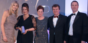 sharon davis presents the team with their award