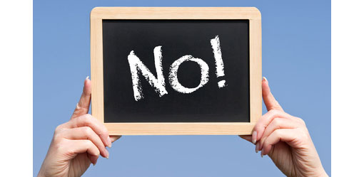 blockboard being held up with word no on it