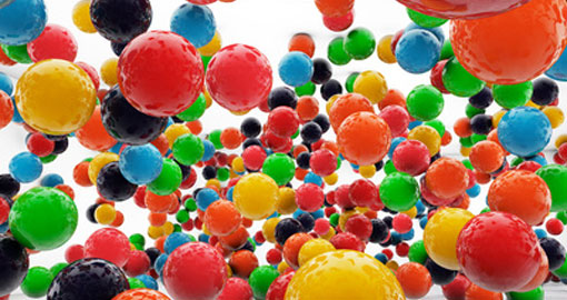 big coloured balls floating in a room