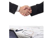 hand shake and financial papers