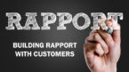 Rapport and building rapport with customers is written in a chalkboard style by a hand