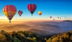 12 hot air balloons in the sky