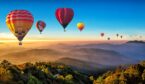 12 hot air balloons in the sky