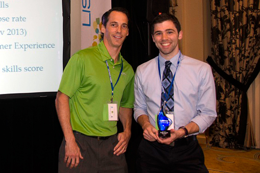 Collin Rainey receiving his award from CallMiner's Scott Kendrick.