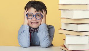 A pictre of a frustrated boy with books