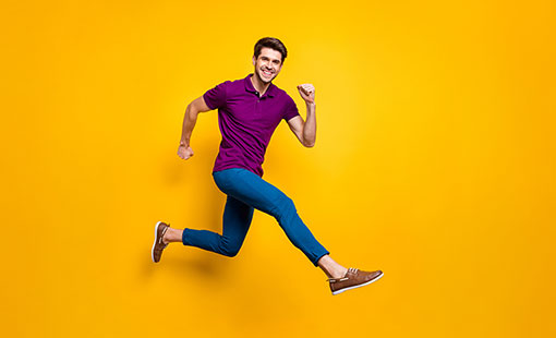 A photo of someone in a happy running pose