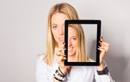 Lady holding up photo frame