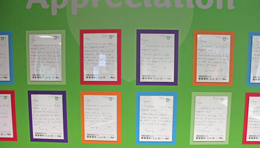 Letters written by the CEO for agents who perform well are displayed on a colourful green background