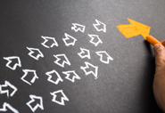 A group of white arrows, follow a yellow arrow