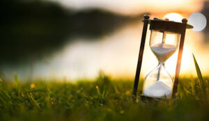 sand timer on sun rise background