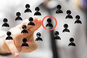 People icons with one circled and being pointed at