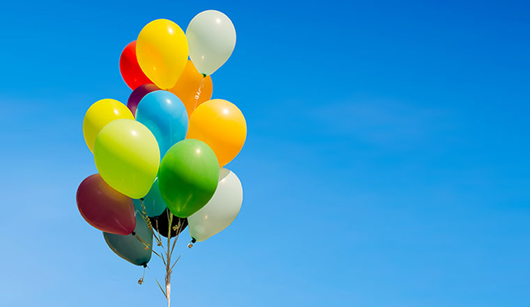 Colourful bunch of helium balloons