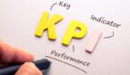 Wood letter of KPI abbreviation with hand writing definition