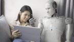 asian woman talking to robot while using digital tablet at home