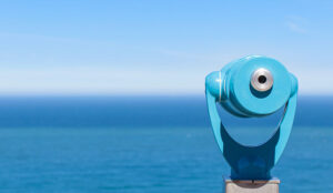 A blue periscope looks over the blue horizon