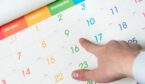 A man points to Wednesday 9th on a calendar