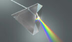 The crystal prism disperses white light into many colors.