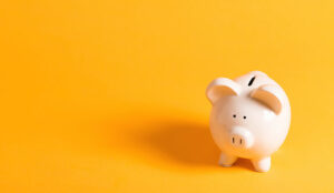 White piggy bank on a yellow background