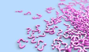 Lots of pink question marks scattered on a blue background