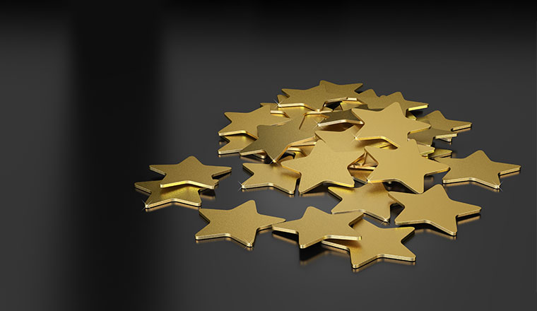 3D illustration of many golden stars over black background,