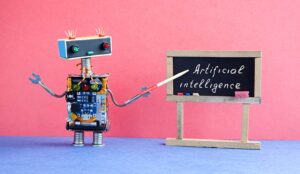 A picture of a robot pointing to chalkboard