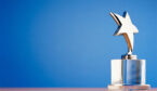 A photo of a star award against a gradient background