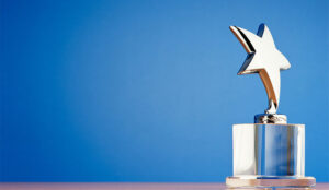 A photo of a star award against a gradient background