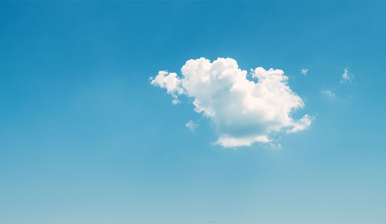 A photo of the sky and a lonely cloud