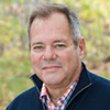 A headshot of Mark Bishof