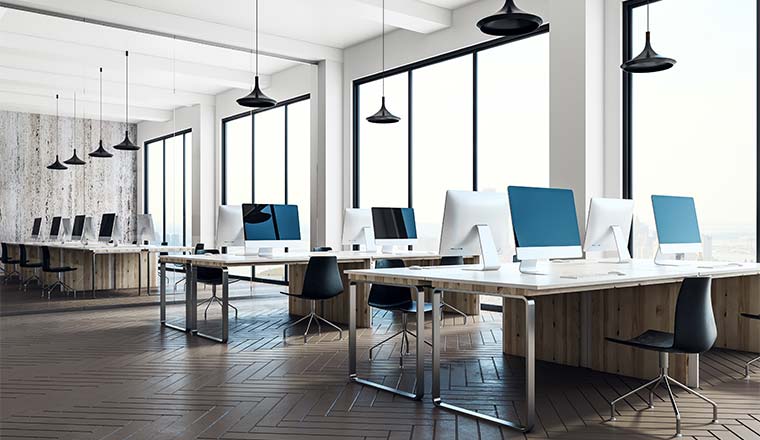 Minimalistic coworking office interior with equipment, furniture, city view and daylight.