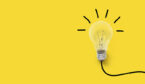 A picture of a light bulb on yellow background