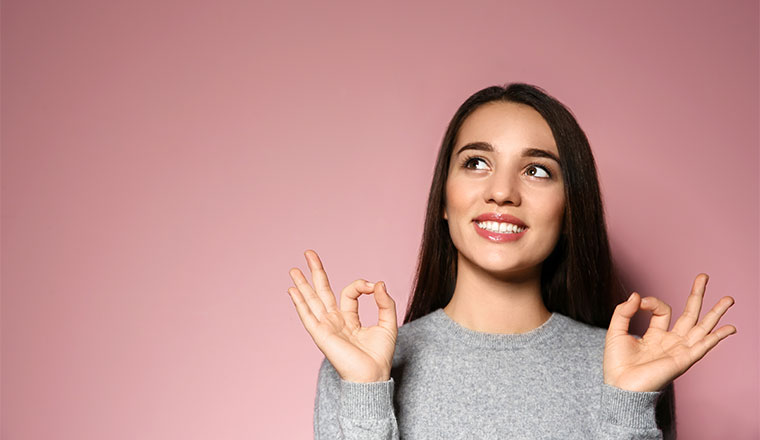 A photo of someone making an "okay" gesture