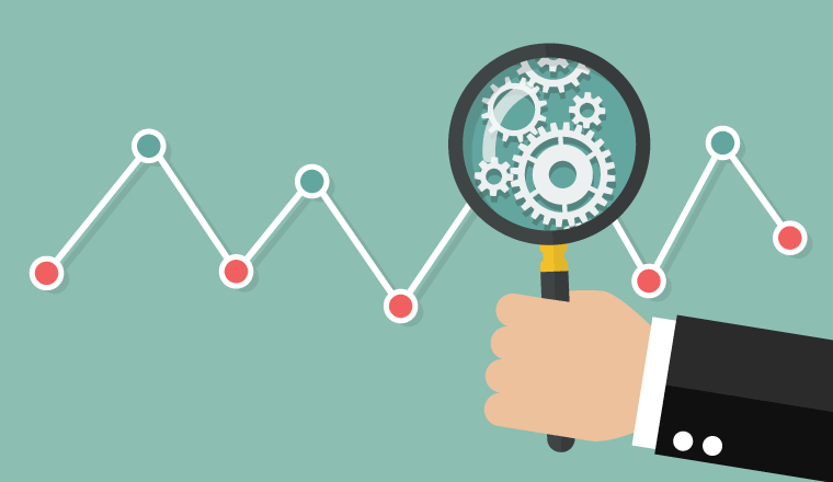 A picture of cogs under a magnifying glass on graph