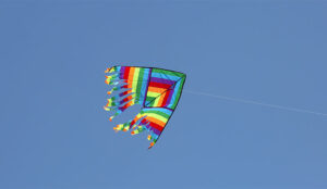 A photo of a kite flying on a clear day