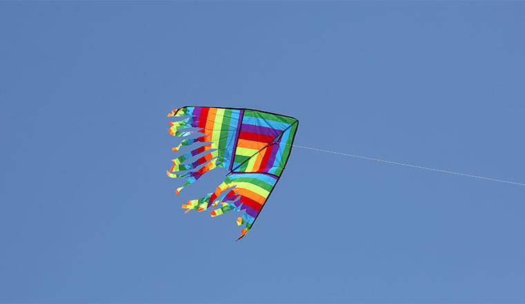 A photo of a kite flying on a clear day