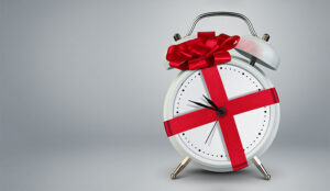 A photo of a clock with a ribbon around it