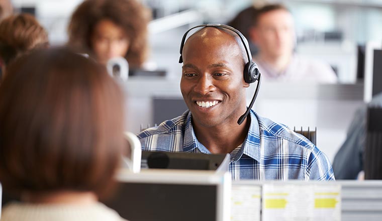 A photo of a smiling contact centre advisor