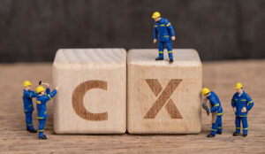 A picture of wooden blocks spelling out "CX"