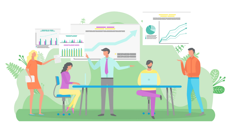 A group sits around a table with graphs on the wall behind