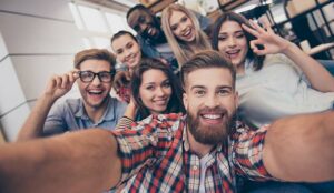 A group of young employees taking a selfie