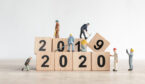 Little workman figures on top of 2020 building blocks