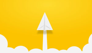 A paper plane points towards the top of the image with a yellow background