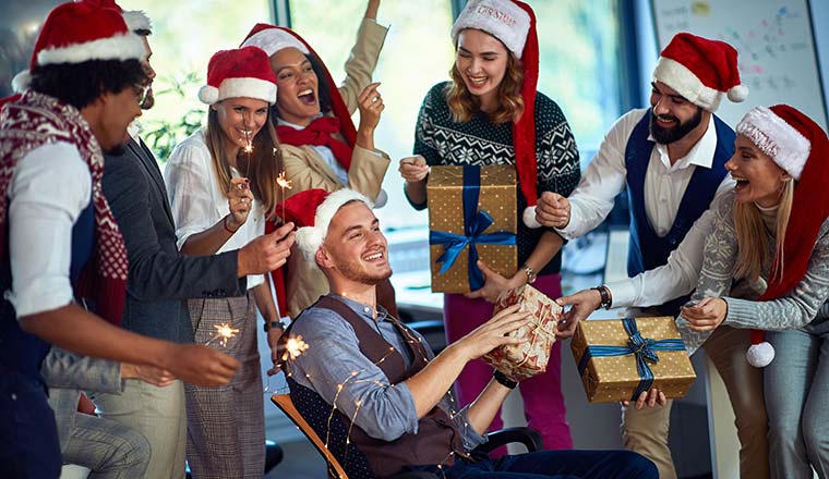 A photo of an office team having fun a Christmas