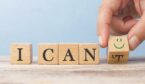 A photo of wooden blocks saying I can, with a hand changing a 't' to a smiley face